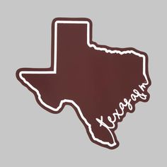 the texas state outline sticker is brown and white