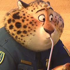 the cheetah is wearing a police uniform and listening to ear buds in his mouth