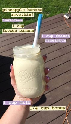 a hand holding a mason jar filled with ice cream and labeled ingredients for the recipe