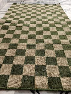 a green and white rug on the floor