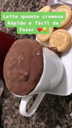 there is a coffee cup and some cookies on the table with it's name written in spanish