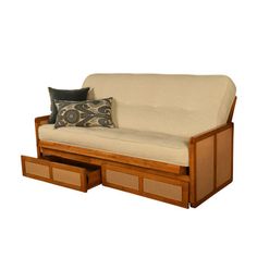 a couch with two drawers underneath it and a pillow on the bottom shelf next to it