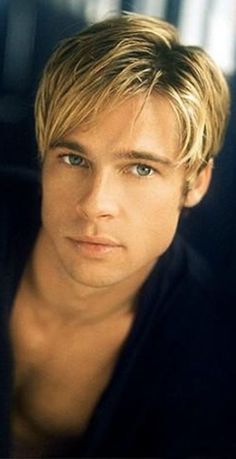 a young man with blonde hair and blue eyes