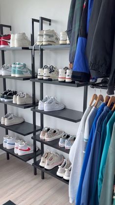 there are many pairs of shoes on the shelves