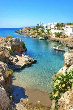 the water is crystal blue and clear with boats in it's waterside area