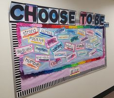 a bulletin board with words and pictures on it that say choose to be, stop, cursive, multicolored