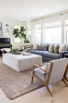 a living room filled with furniture and a piano