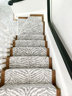 the stairs are decorated with zebra print carpet