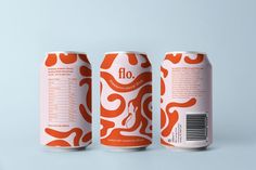 an orange and white can of fio beer on a grey background with the word fio printed on it