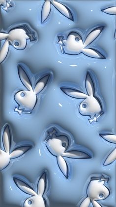 an image of some white rabbits in the water with blue and white paint on them