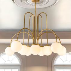 a chandelier hanging from the ceiling in a room