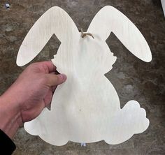 Wood Bunny Crafts, Dollar Tree Rabbit, Dollar Tree Bunny Crafts, Scilla Peruviana, Rabbit Craft, Bunny Shape, Rabbit Crafts, Fun Easter Crafts, Wooden Door Hanger