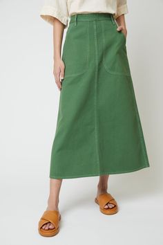 High waisted skirt, standard heavyweight cotton twill. - Relaxed fit- Fitted waist, Mid length skirt- Garment dyes with a front buttons made of recycled paper- Belt pulls on the waist- Two side pockets, one leg pocket, two back pockets Fabric Note Cotton 100%Machine wash gentle / Tumble dry low / No bleachWarm iron if neededDry clean optionalMade in U.S.A Clothes For Artists, 2024 Skirt Trends, A-line Skirt, High Fashion Skirts, Rectangle Skirt, Homemade Skirt, Canvas Skirt, Sewing Skirt, Skirt Embroidery