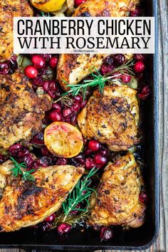 cranberry chicken with rosemary in a roasting pan on top of a wooden table