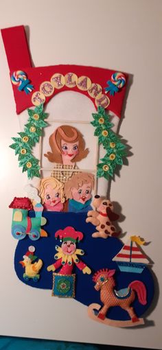 a white refrigerator with magnets on it's front and back sides, including an image of a woman surrounded by toys