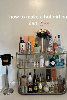 a bar cart filled with liquor bottles and glasses