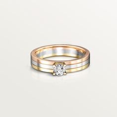 two tone gold and silver wedding rings with a single diamond