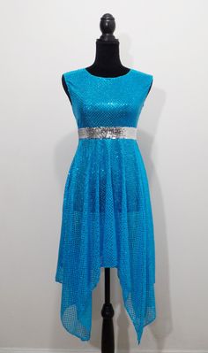 a blue dress on a mannequin with silver sequins and a belt