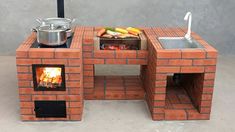 an outdoor grill made out of bricks with a pot and pan on the burner
