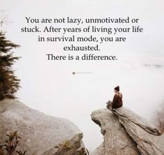 a person sitting on top of a large rock next to a quote that says you are not lazy, unmotched or stuck after years of living your life in survival mode