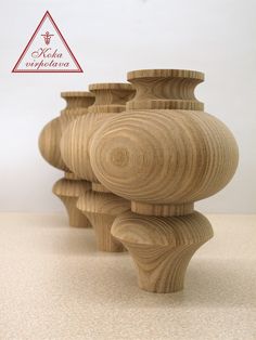 three wooden vases stacked on top of each other