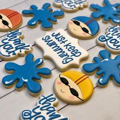 decorated cookies are displayed on a table