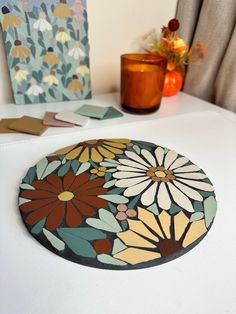 a table topped with lots of different types of paper and flowers on top of it