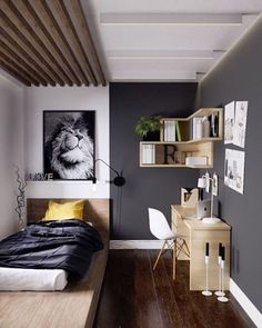 a bedroom with wood floors and gray walls