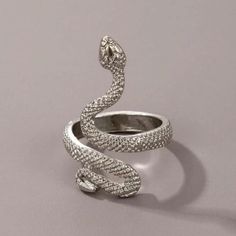 a white gold snake ring with pave diamonds