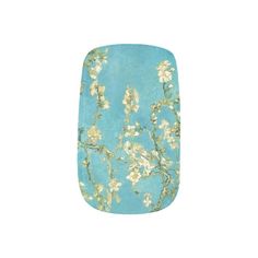 a blue nail with white flowers and green leaves on the top, in front of a white background