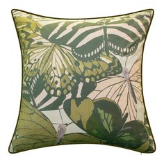 a green and white pillow with butterflies on it