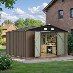 a large brown shed sitting on top of a lush green field next to a tall brick building