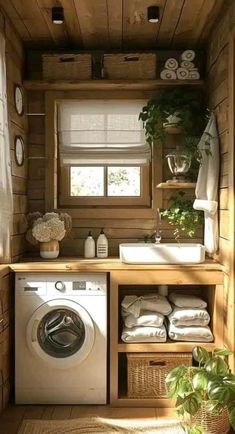 a washer and dryer in a small room with wood paneling on the walls