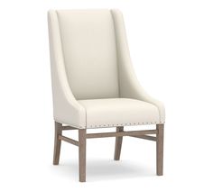 a white upholstered chair with nail - tipped legs and an open back, viewed from the side