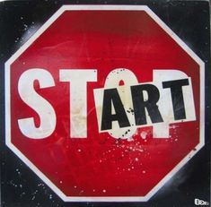 a red stop sign with the word start painted on it's bottom and underneath