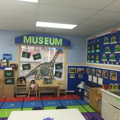 a classroom with toys and pictures on the wall
