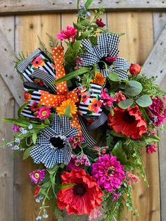 a vase filled with lots of colorful flowers