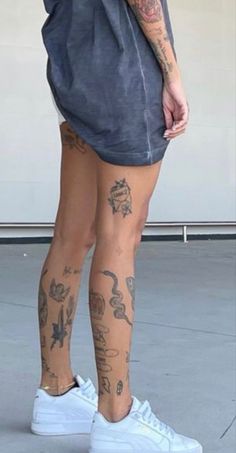 a person with tattoos on their legs