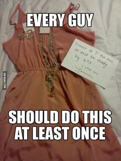 a dress that is laying on top of a bed with a note attached to it