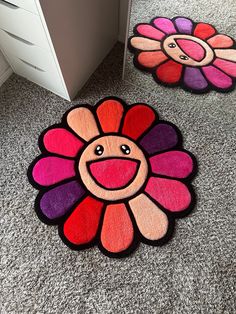 two flower rugs on the floor in an office