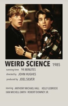 two young men standing next to each other in front of a white poster with the words weird science on it