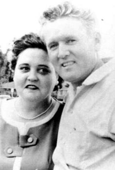 black and white photo of two people posing for the camera