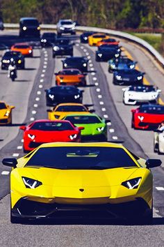 a bunch of cars that are sitting in the street together, all facing different directions