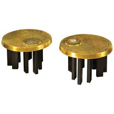 two black and gold side tables on white background