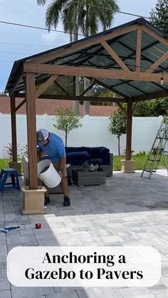 a man working on an outdoor patio area