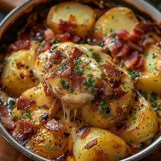 a pan filled with potatoes covered in bacon and cheese