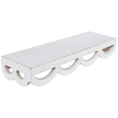 a white wooden shelf with three shelves on each side and two holes in the middle