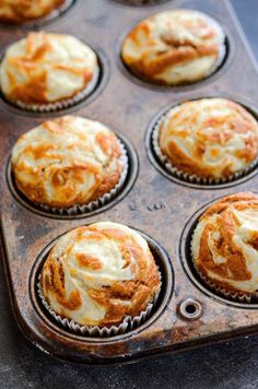 freshly baked cinnamon rolls in a muffin tin ready to be eaten for breakfast or dessert