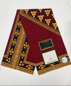 two pieces of cloth with designs on them, one is red and the other is yellow