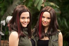 two beautiful young women standing next to each other